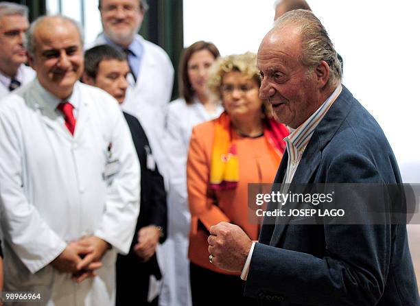 Spain's King Juan Carlos I speaks to journalists at the Clinic Hospital of Barcelona on May 11, 2010. A smiling Spain's King Juan Carlos left the...