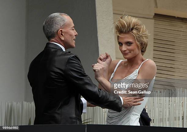 French designer Jean-Claude Jitrois and friend Sarah Marshall attend a photo shoot on a balcony prior to the annual film festival on May 11, 2010 in...