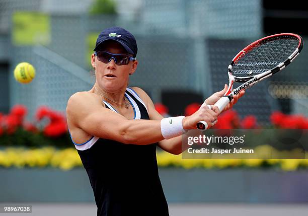 Samantha Stosur of Australia plays a ball to Maria Jose Martinez Sanchez of Spain in their first round match during the Mutua Madrilena Madrid Open...