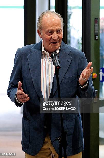 Spain's King Juan Carlos I speaks to the press at the Clinic Hospital of Barcelona on May 11, 2010. A smiling Spain's King Juan Carlos left the...