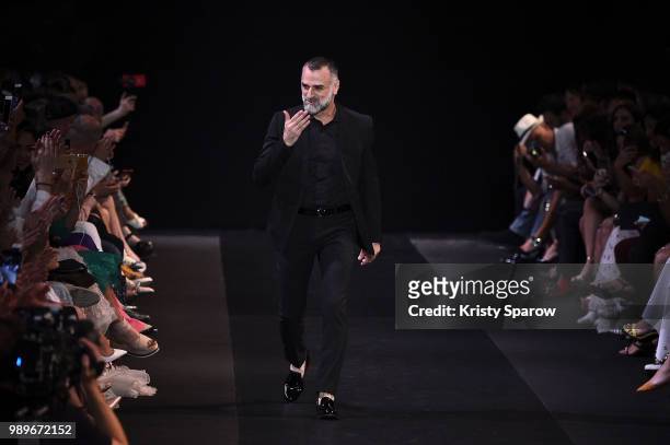 Designer George Hobeika acknowledges the audience during the George Hobeika Haute Couture Fall Winter 2018/2019 show as part of Paris Fashion Week on...