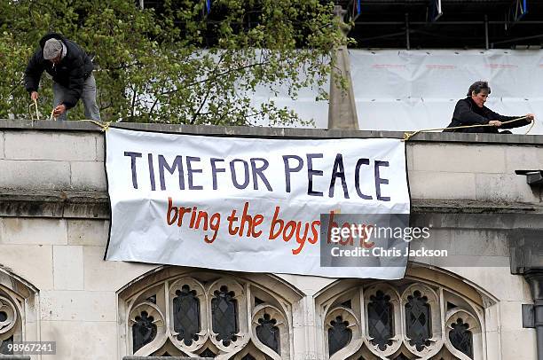 Protesters gather on the roof of St Margarets Chapel opposite the Houses of Parliament in Westminster on May 11, 2010 in London, England. British...