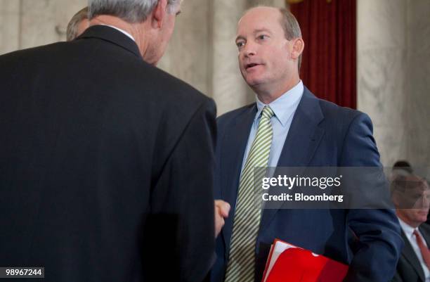 Lamar McKay, president and chairman of BP America Inc., right, greets Senator Jeff Bingaman, a Democrat from New Mexico and chairman of the Senate...