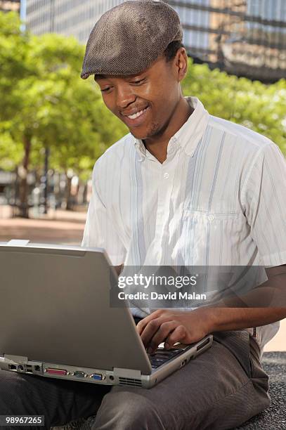 young man with laptop, cape town, western cape province, south africa - western cape province stock-fotos und bilder