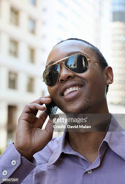 young man using mobile phone, cape town, western cape province, south africa - western cape province stock-fotos und bilder