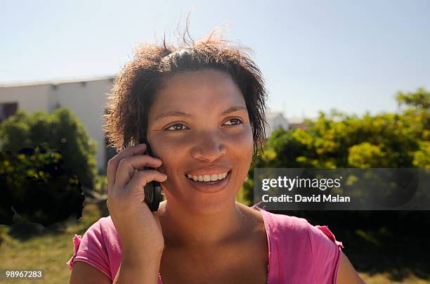 woman using mobile phone, st francis bay, sea vista, eastern cape province, south africa - malan stock-fotos und bilder