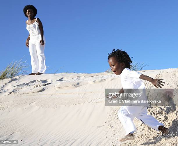mother and son playing on sand dune, pringle bay, cape town, western cape province, south africa - western cape province fotografías e imágenes de stock