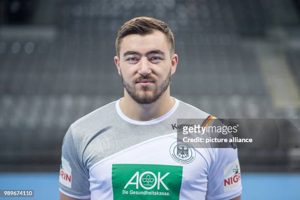Jannik Kohlbacher, player of the German handball national team, looks into the camera during a team's press conference in Stuttgart, Germany, 4...