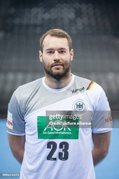 Steffen Faeth, player of the German handball national team, looks into the camera during a team's press conference in Stuttgart, Germany, 4 January...