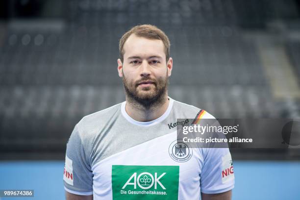 Steffen Faeth, player of the German handball national team, looks into the camera during a team's press conference in Stuttgart, Germany, 4 January...