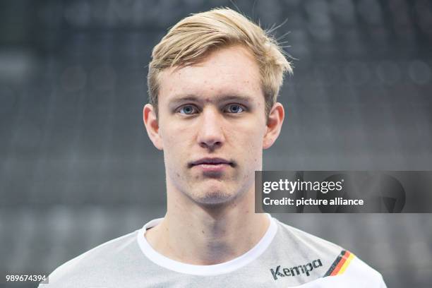 Marian Michalczik, player of the German handball national team, looks into the camera during a team's press conference in Stuttgart, Germany, 4...