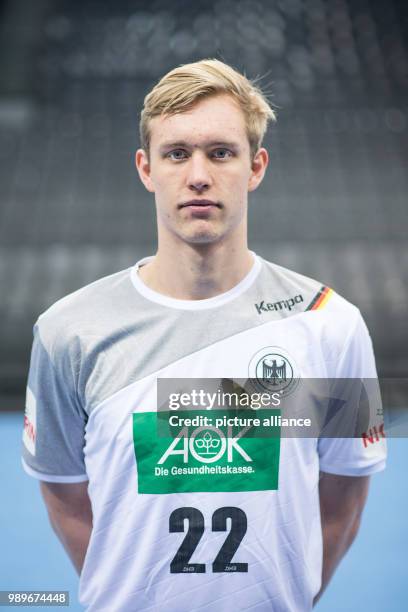 Marian Michalczik, player of the German handball national team, looks into the camera during a team's press conference in Stuttgart, Germany, 4...