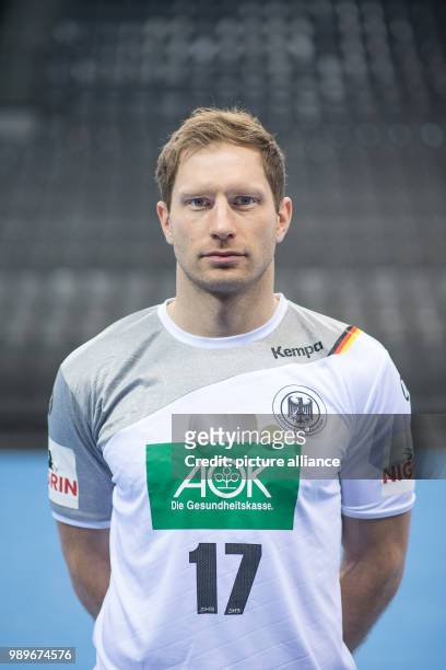 Steffen Weinhold, player of the German handball national team, looks into the camera during a team's press conference in Stuttgart, Germany, 4...