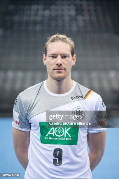 Tobias Reichmann, player of the German handball national team, looks into the camera during a team's press conference in Stuttgart, Germany, 4...