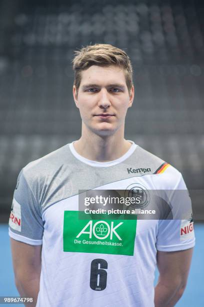 Finn Lemke, player of the German handball national team, looks into the camera during a team's press conference in Stuttgart, Germany, 4 January...