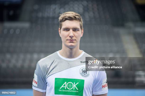 Finn Lemke, player of the German handball national team, looks into the camera during a team's press conference in Stuttgart, Germany, 4 January...