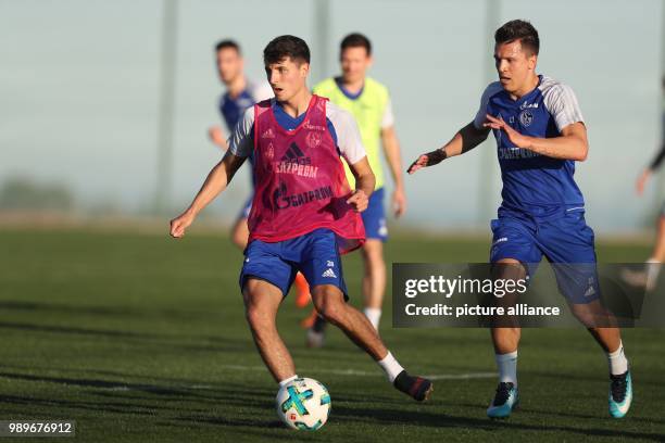 Schalke's Alessandro Schoepf in action against Schalke's Yevhen Konoplyanka at the winter training camp of Bundesliga team FC Schalke 04 in Benidorm,...