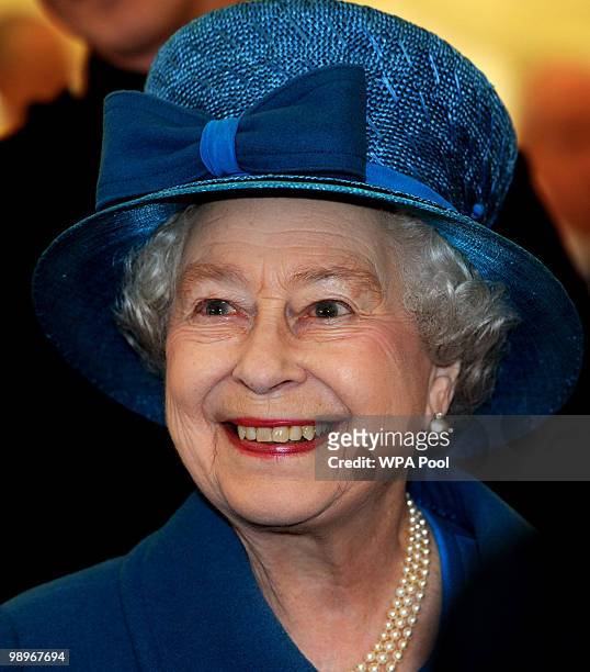 Queen Elizabeth II smiles as she meets members of the Grenadier Guards after presenting the regiment with their new colours on May 11, 2010 in...