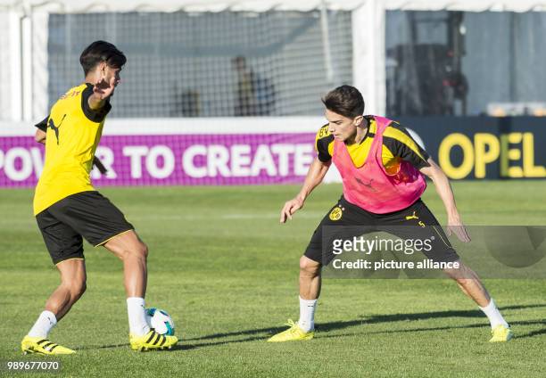 Dortmund's Marc Bartra and Mahmoud Dahoud vie for the ball during the winter training camp of Bundesliga team Borussia Dortmund in Marbella, Spain, 5...