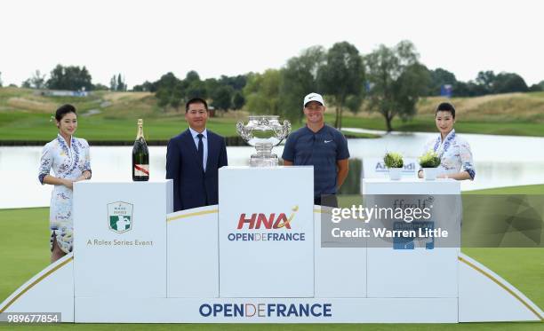 Alex Noren of Sweden is awarded the trophy by Zhao Quan, Member of the Board of Directors, HNA Group Chairman and CEO, HNA Aviation Group after the...