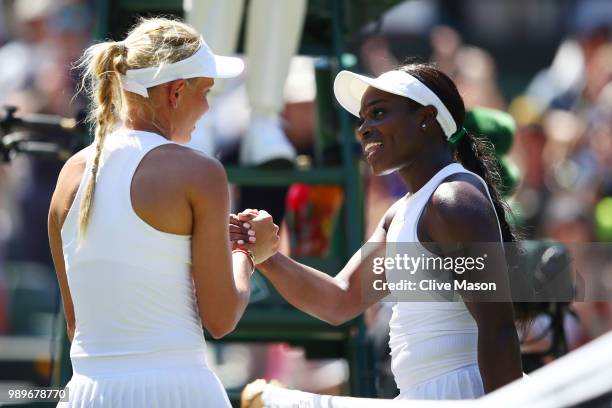 Donna Vekic of Croatia shakes hands with Sloane Stephens of The United States after their Ladies' Singles first round match on day one of the...