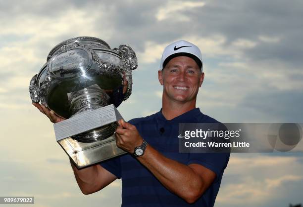 Alex Noren of Sweden poses with the trophy after winning the HNA Open de France at Le Golf National on July 1, 2018 in Paris, France.