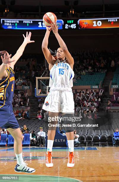 Kia Vaughn of the New York Liberty shoots the basketball against Kelsey Griffin of the Connecticut Sun during the preseason WNBA game on May 11, 2010...