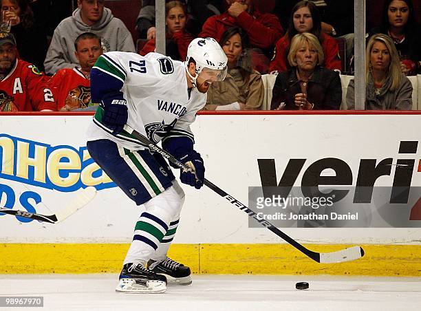 Daniel Sedin of the Vancouver Canucks moves with the puck against the Chicago Blackhawks in Game Five of the Western Conference Semifinals during the...