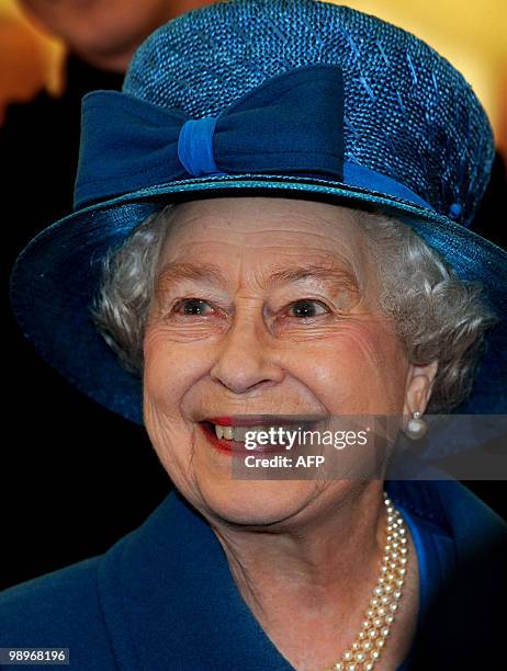 British Queen Elizabeth smiles as she meets soldiers from The 1st Battalion Grenadier Guards after presenting them with their new colours at...