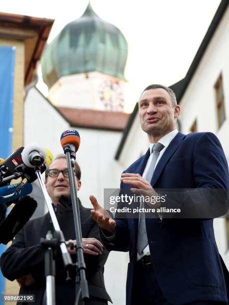 German Minister of Transport Alexander Dobrindt stands behind former Ukrainian boxing pro, mayor of Kiev and chairman of Ukrainian government party...