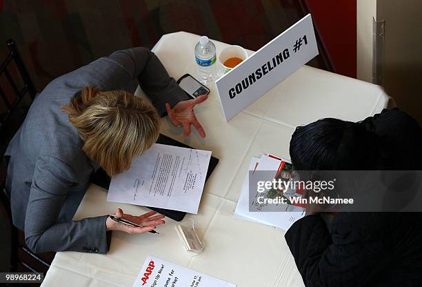 Job applicants are counseled with career advice during a jobs fair at Nationals Park co-hosted by the AARP May 11, 2010 in Washington, DC. The U.S....