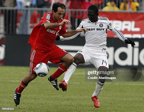 Nick Labrocca of Toronto FC battles for the ball with Patrick Nyarko of the Chicago Fire during a MLS game against the Toronto FC at BMO Field May 8,...