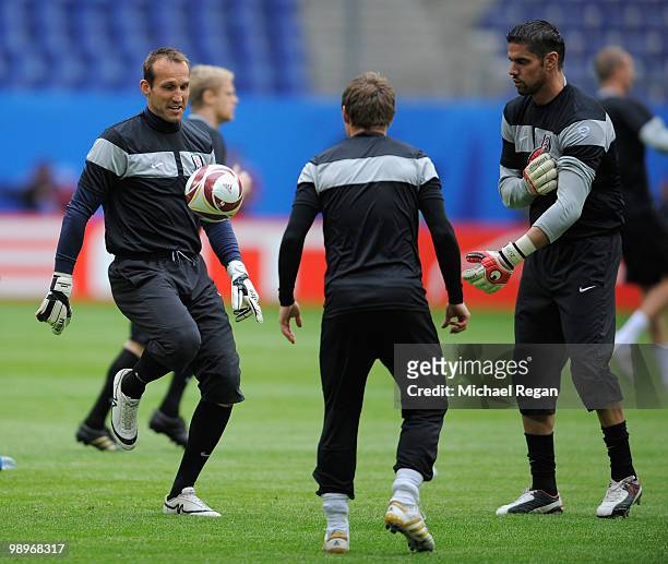 Goalkeepers Mark Schwarzer and Pascal Zuberbuehler practice during the Fulham training session ahead of the UEFA Europa League final match against...