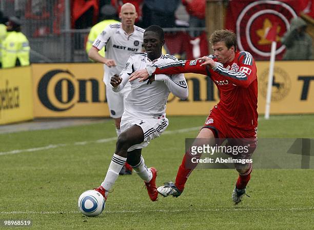 Jacob Peterson of Toronto FC battles for the ball with Patrick Nyarko of the Chicago Fire during a MLS game at BMO Field May 8, 2010 in Toronto,...