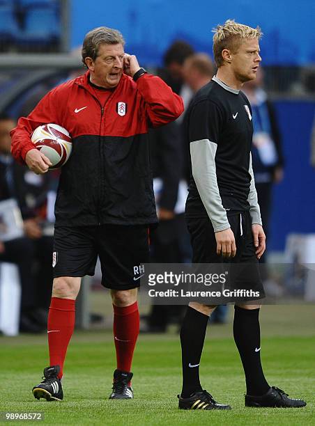 Head coach Roy Hodgson issues instructions as Damien Duff looks on during the Fulham training session ahead of the UEFA Europa League final match...