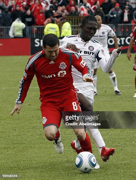Dan Gargan of Toronto FC is bumped by Patrick Nyarko of the Chicago Fire during a MLS game at BMO Field May 8, 2010 in Toronto, Ontario, Canada.