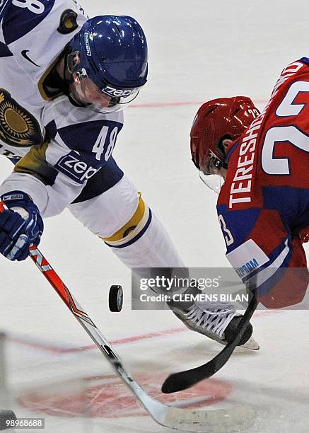 Russia's Alexei Tereshchenko vies with Kazakhstan's Roman Starchenko during the IIHF Ice Hockey World Championship match Russia vs Kazakhstan in the...