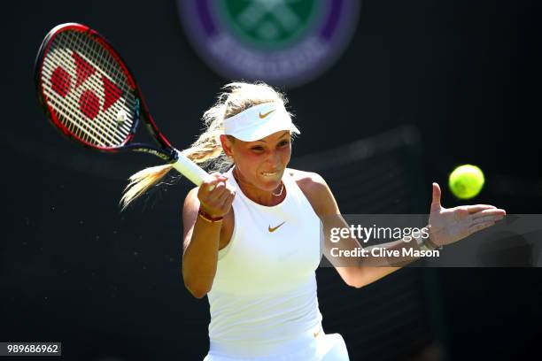 Donna Vekic of Croatia returns to Sloane Stephens of The United States during their Ladies' Singles first round match on day one of the Wimbledon...