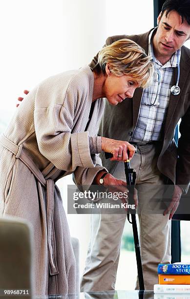 doctor examines senior woman with bad problems - newhealth stock pictures, royalty-free photos & images