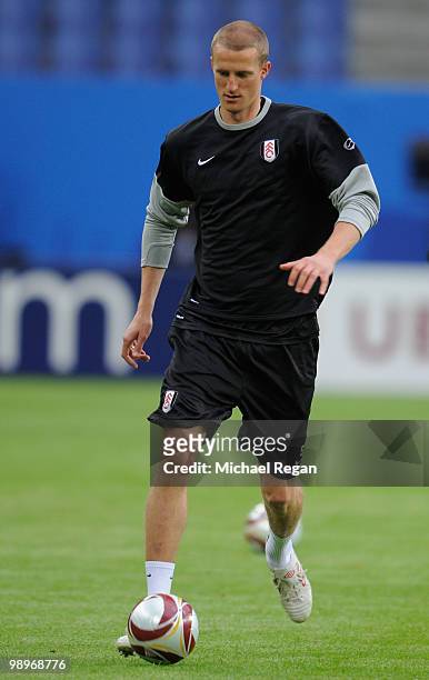 Brede Hangeland runs with the ball during the Fulham training session ahead of the UEFA Europa League final match against Atletico Madrid at HSH...