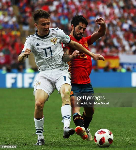 Aleksandr Golovin of Russia vies with Isco of Spain nduring the 2018 FIFA World Cup Russia Round of 16 match between Spain and Russia at Luzhniki...