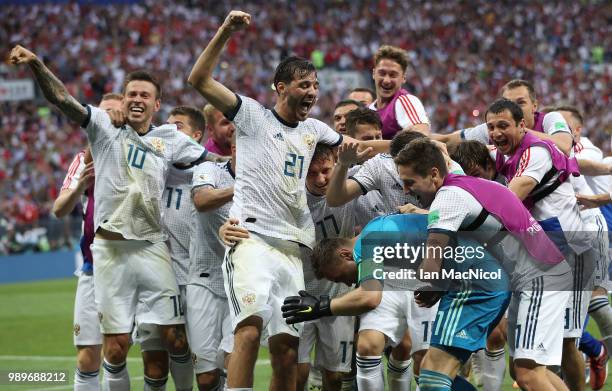 Aleksandr Erokhin of Russia celebrates after his team win a penalty shoot out during the 2018 FIFA World Cup Russia Round of 16 match between Spain...