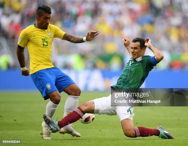 Rafael Marquez of Mexico tackles Paulinho of Brazil during the 2018 FIFA World Cup Russia Round of 16 match between Brazil and Mexico at Samara Arena...