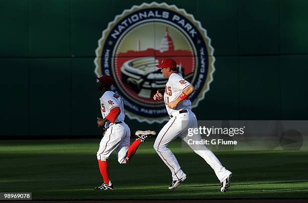 Ryan Zimmerman and Nyjer Morgan of the Washington Nationals warm up before the game against the Atlanta Braves at Nationals Park on May 4, 2010 in...