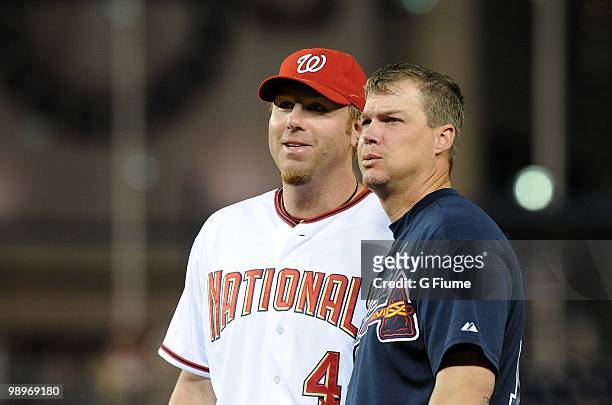 Adam Dunn of the Washington Nationals talks with Chipper Jones of the Atlanta Braves during the game at Nationals Park on May 4, 2010 in Washington,...