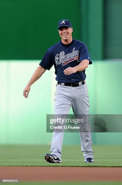 Chipper Jones of the Atlanta Braves laughs as he warms up before the game against the Washington Nationals at Nationals Park on May 4, 2010 in...