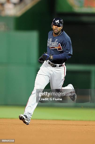 Jason Heyward of the Atlanta Braves rounds the bases after hitting a home run in the fourth inning against the Washington Nationals at Nationals Park...