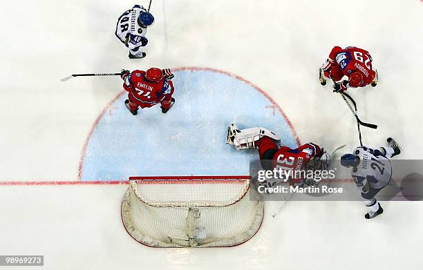 Alexander Emerenko, goalkeeper of Russia saves the shot of Dmitri Dudarev of Kazakhstan during the IIHF World Championship group A match between...