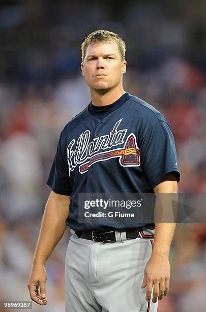 Chipper Jones of the Atlanta Braves waits for his glove between innings of the game against the Washington Nationals at Nationals Park on May 4, 2010...