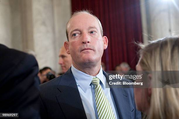 Lamar McKay, president and chairma of BP America Inc., talks to aides during a Senate Energy and Natural Resources Committee hearing on offshore oil...